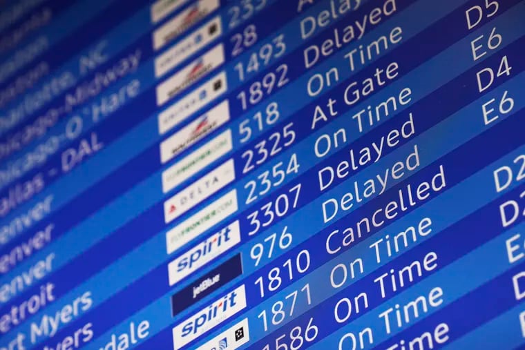 File photo of an arrivals screen at Philadelphia International Airport in Philadelphia in 2021.