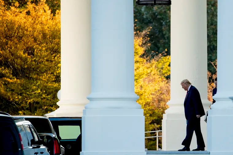 President Donald Trump walks out of the North Portico of the White House to travel to Andrews Air Force Base, Md., and then on to Chicago.