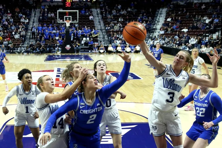 Kennedy Townsend (center) of Creighton watches the ball sail out of bounds after Lucy Olsen (right) of Villanova blocked her shot during the first half of a Big East Tournament semifinal game on March 5, 2023 at Mohegan Sun In Uncasville, CT.