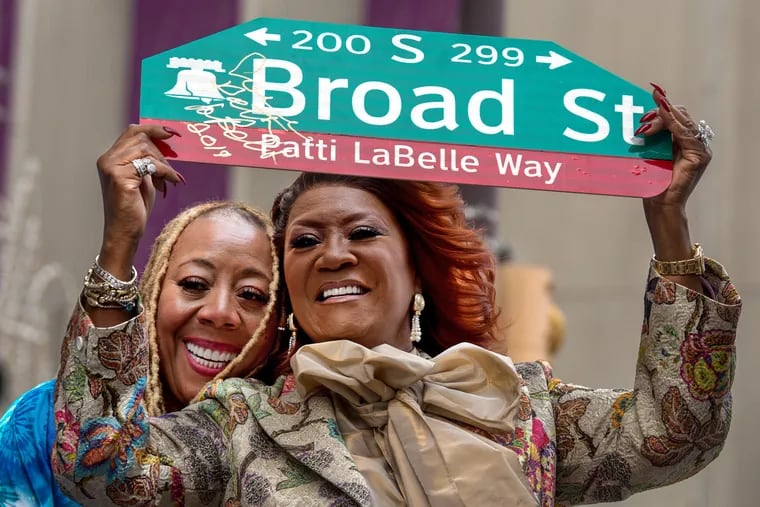 Patti LaBelle (right), seen here holding up a signed of the renamed Patti LaBelle Way in 2019, will headline tonight's PHLove benefit show.