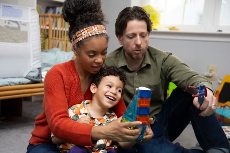 Sana, Apollo, 4, and Zach Garner play in Apollo’s room at their home in Ardmore. Apollo receives treatment for cerebral palsy at CHOP.