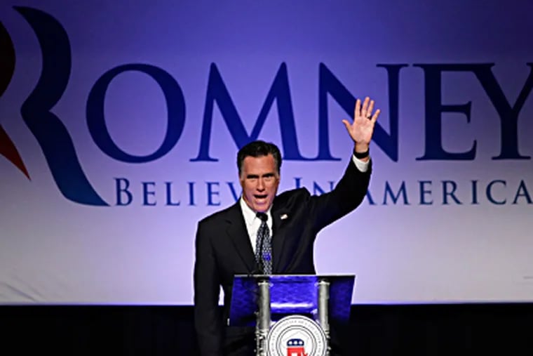 Republican presidential candidate Mitt Romney waves after addressing the Lancaster County GOP's annual dinner Tuesday night. Romney also received endorsements on Tuesday from House Speaker John A. Boehner and Senate Republican leader Mitch McConnell. JAE C. HONG / Associated Press