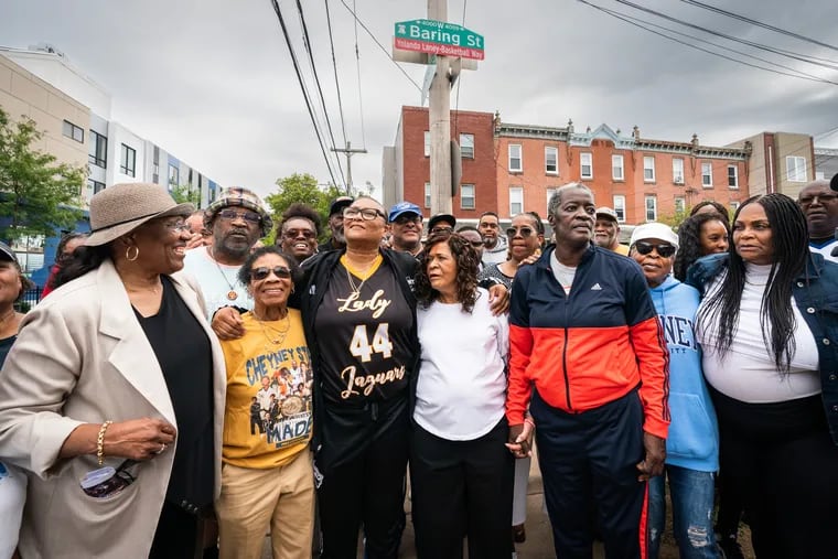 Yolanda Laney (center) stands with former coaches and teammates(from left) Lydia Hawkins, former Assistant Coach at University City; Bunny Schaffer, Former assistant coach at Cheyney; C. Vivian Stringer, Former women’s basketball coach at Cheyney; and Debbie Walker, who played at Cheyney, at an event that honored Laney with a street named for her at 40th and Baring Streets.