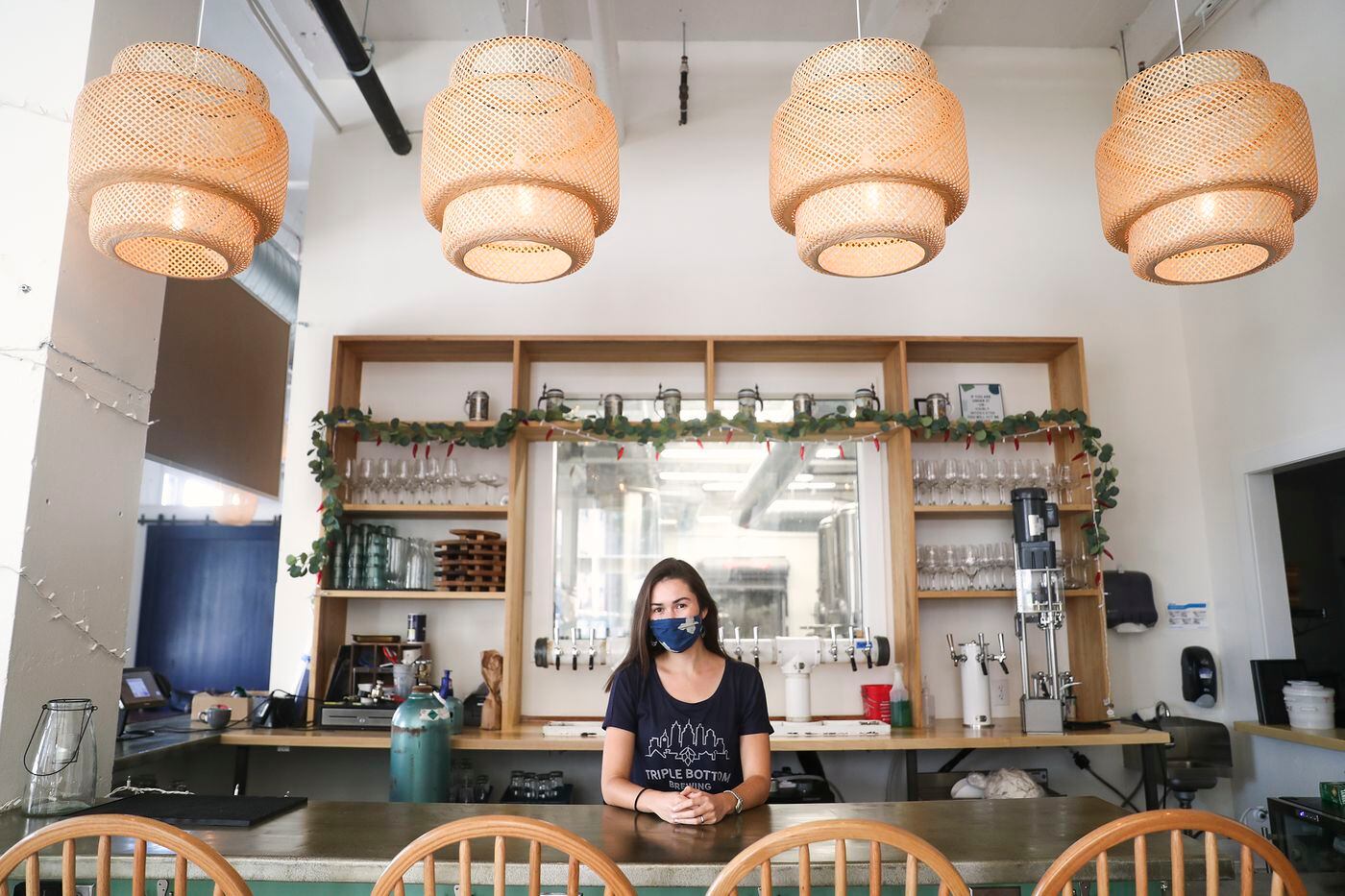 Tess Hart, co-founder and CEO of Triple Bottom Brewing, poses for a portrait inside the Spring Garden brewery. Hart recently started a supper club to celebrate the talents of diverse chefs, mostly women and BIPOC, and also collaborates with Project HOME and the Youth Sentencing and Reentry Project.