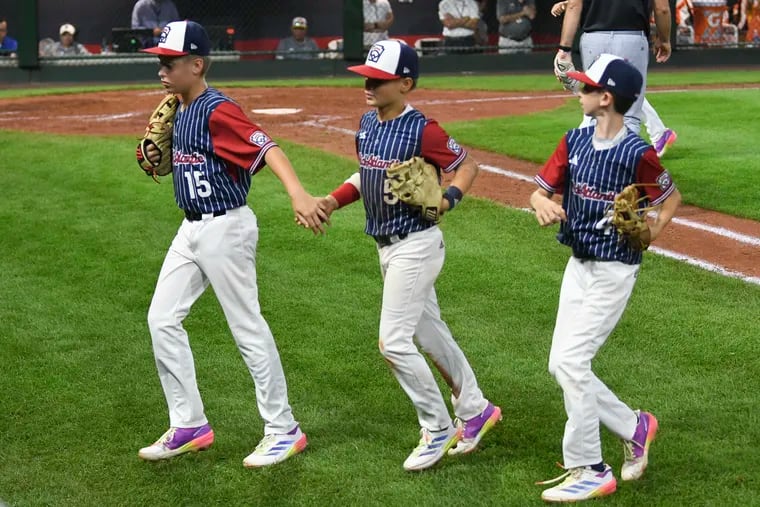 The team from Council Rock North will play at least one more game in the Little League World Series.