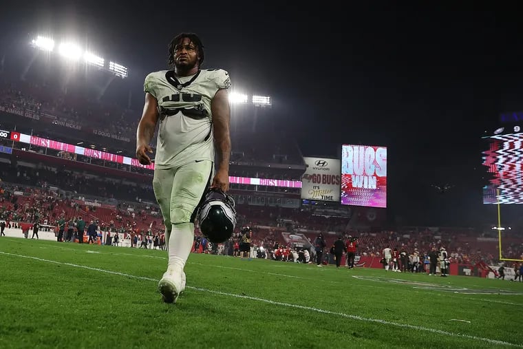 Eagles defensive tackle Jalen Carter walks off the field after the playoff loss to the Buccaneers on Jan. 15.