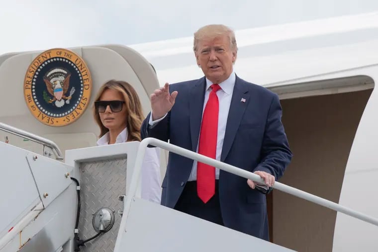 President Donald Trump and first lady Melania Trump disembark Air Force One upon arrival at Morristown Municipal Airport, in Morristown, N.J., Friday, July 5, 2019.