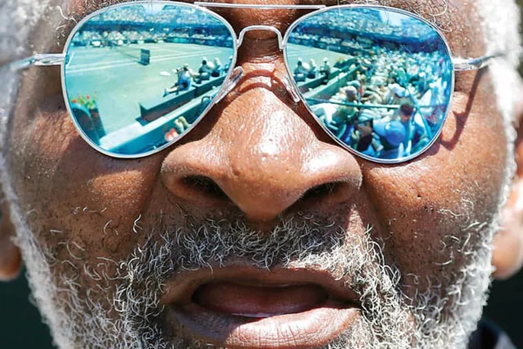 Richard Williams cheers for his daughter, Serena Williams, between points of her semifinal match against Samantha Stosur, of Australia, at the Family Circle Cup tennis tournament in Charleston, S.C., Saturday, April 7, 2012.  Williams advanced to the finals by winning 6-1, 6-1.  (AP Photo/Mic Smith)
