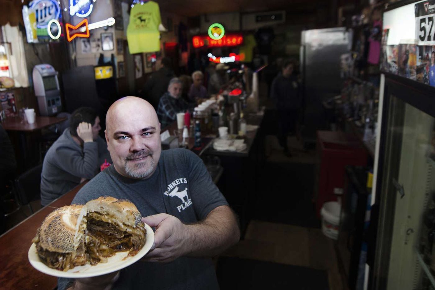 Rob Lucas, third generation owner of Donkey’s Place, shows off a signature Donkey’s cheesesteak.
