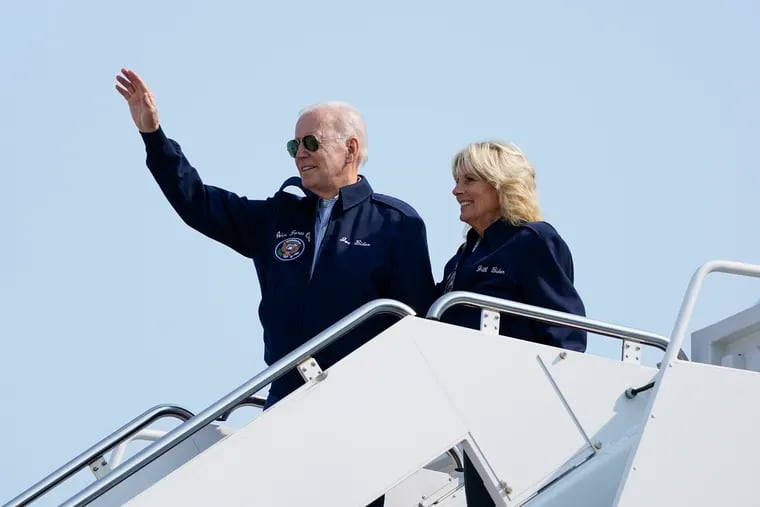 President Joe Biden waves as he stands at the top of the steps of Air Force One before boarding with first lady Jill Biden at Andrews Air Force Base, Md., Saturday, Sept. 17, 2022, as they head to London to attend the funeral for Queen Elizabeth II. To commemorate the U.S. Air Force's 75th Anniversary as a service the Bidens are wearing Air Force One jackets.