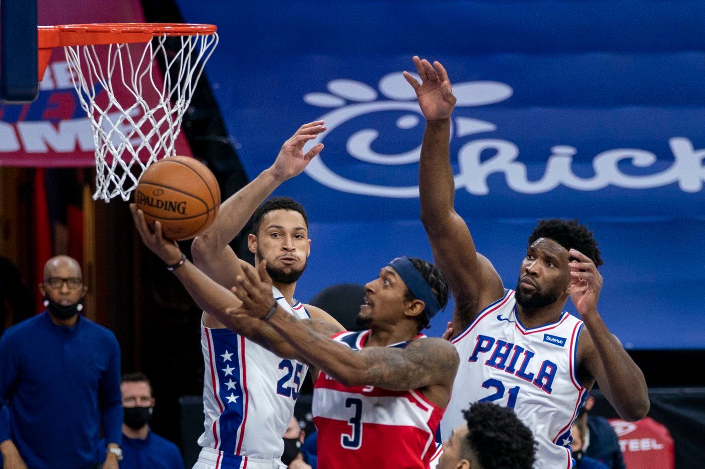 Washington Wizards guard Bradley Beal going up for two of his career-high 60 points against Sixers guard Ben Simmons and center Joel Embiid on Jan. 6.