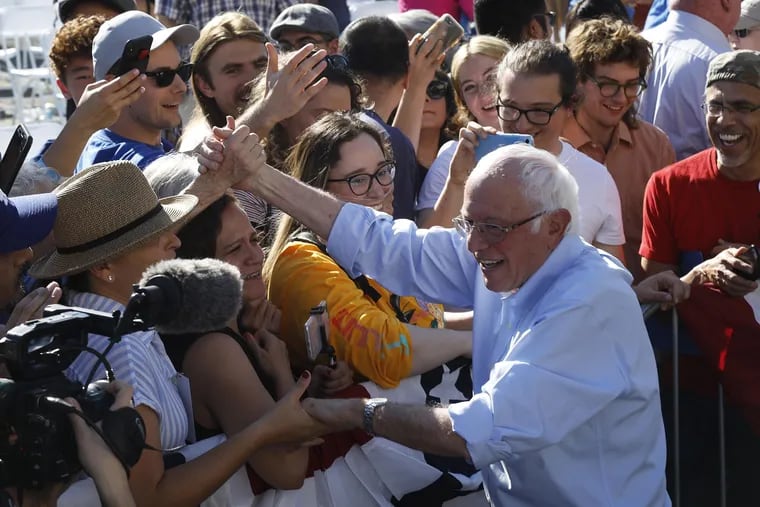 A smiling Senator Bernie Sanders greets supporters at the end of his 2020 Rally at Woodrow Wilson Senior High School on Nov. 16, 2019 in Los Angeles. (Genaro Molina/Los Angeles Times/TNS)