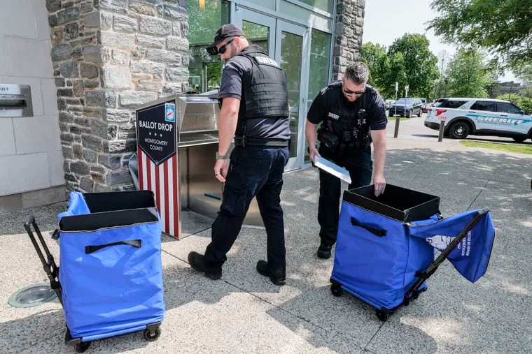 Montgomery County Sheriff Deputies pick up mail-in-ballots at the Ludington Library in Bryn Mawr,  Monday, May 15, 2023 