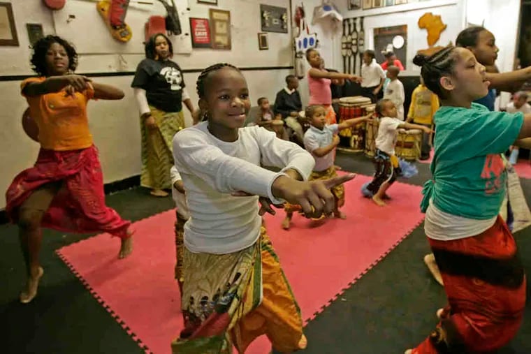 Karima Dickerson (center left), 10, rehearses with the rest of the Universal African Dance and Drum Ensemble. The Camden troupe has been invited to perform in Senegal, and needs about $35,000 to make the trip.