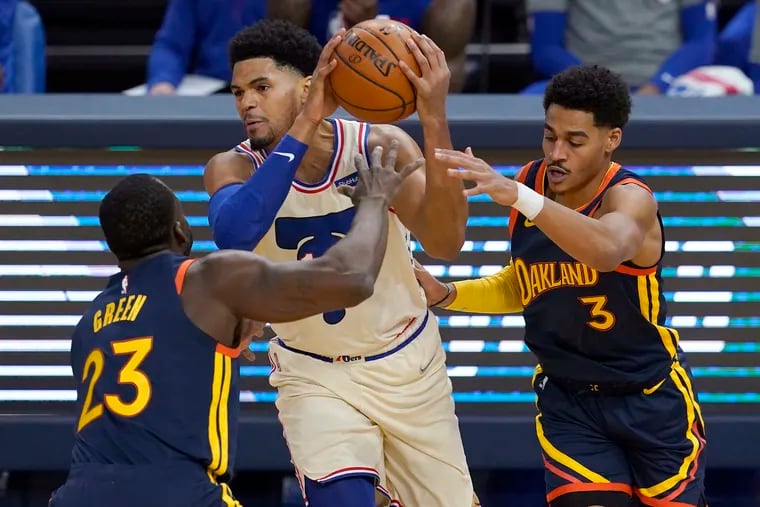 Sixers forward Tobias Harris (middle) came up clutch in the fourth quarter of Tuesday's win against Golden State.
