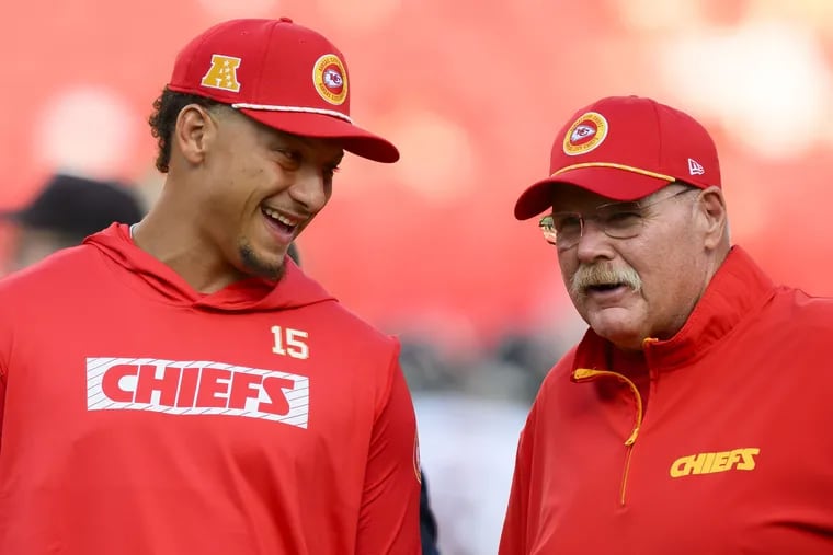 Chiefs quarterback Patrick Mahomes laughs with head coach Andy Reid ahead of a preseason game last month.