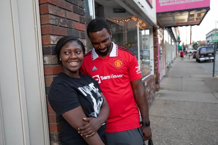 Amy Karpu, a Liberian immigrant, and Matthew Gbouku, an immigrant from Sierra Leone, in downtown Charleroi, Pa. Haitian immigrants had been breathing life into the small Western Pa. town until Donald Trump began disparaging and spreading lies about them.