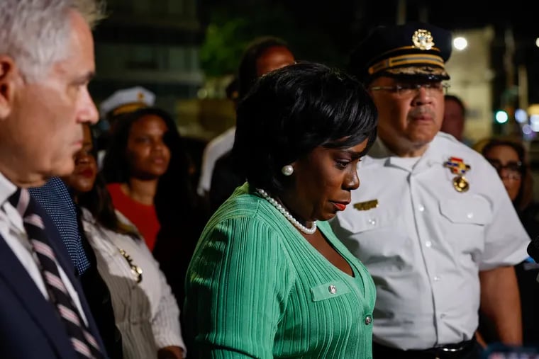 Mayor Cherelle L. Parker, District Attorney Larry Krasner (left), and Police Commissioner Kevin Bethel (right) during a news conference at the Temple trauma and emergency center in Philadelphia on Saturday after an officer was wounded in a shooting near the 3600 block of F Street.