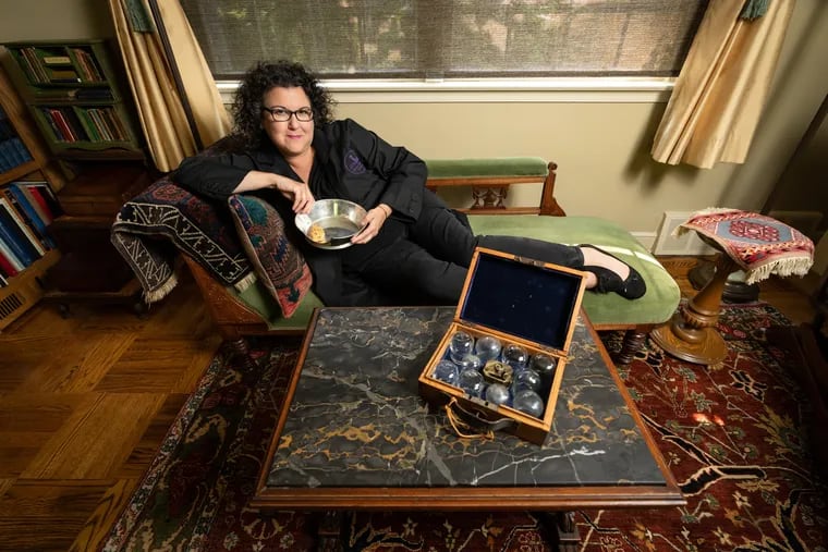 Anna Dhody, the former curator of the Mütter Museum, in Elkins Park, Philadelphia, July 15  2024. She is shown here with antique instruments used for bleeding patients.