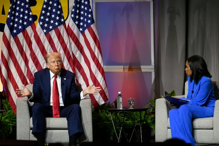 Former President Donald Trump left, participates in a discussion at the National Association of Black Journalists Convention and Career Fair in Chicago, Wednesday, July 31, 2024.