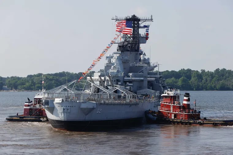 The Battleship New Jersey leaves the dry dock at the Philly Shipyard on Friday morning to cross the Delaware River to the Paulsboro Marine Terminal after undergoing renovations and inspections totaling $10 million.