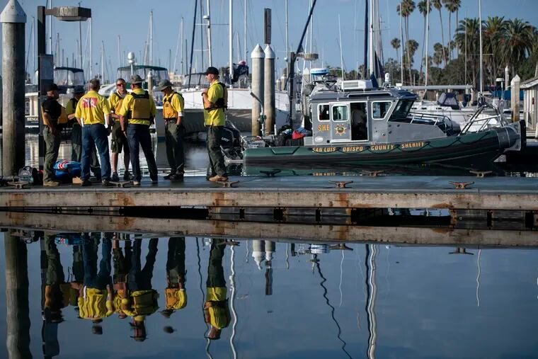 Divers with the San Luis Obispo County Sheriff's Dive Team prepare to search for a second day for missing people following a dive boat fire off Southern California's coast that killed dozens sleeping below deck, in Santa Barbara, Calif., Tuesday, Sept. 3, 2019.