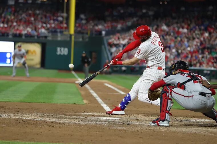 Washington Nationals outfielder Bryce Harper (34) hits go ahead home run  during the top of the tenth inning of game against the Philadelphia  Phillies at Citizens Bank Park in Philadelphia, Pennsylvania on