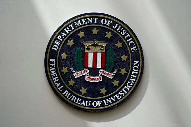 FILE - An FBI seal is seen on a wall on Aug. 10, 2022, in Omaha, Neb. An Idaho teenager is charged with attempting to provide material support to the terrorist group ISIS after prosecutors said he planned to carry out an attack on a Coeur d'Alene church. Alexander Scott Mercurio was arrested on Saturday, April 6, 2024, and the charges were unsealed in Idaho's U.S. District Court on Monday. (AP Photo/Charlie Neibergall, File)