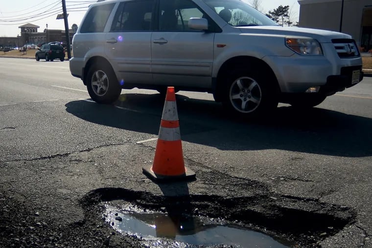 A pothole on Haddonfield Road in Cherry Hill March 9, 2015 (since filled). The thaw has arrived, and so has a harvest of road-bed canyons. The pothole virus has spread rapidly this week, and it's not going to get any better.