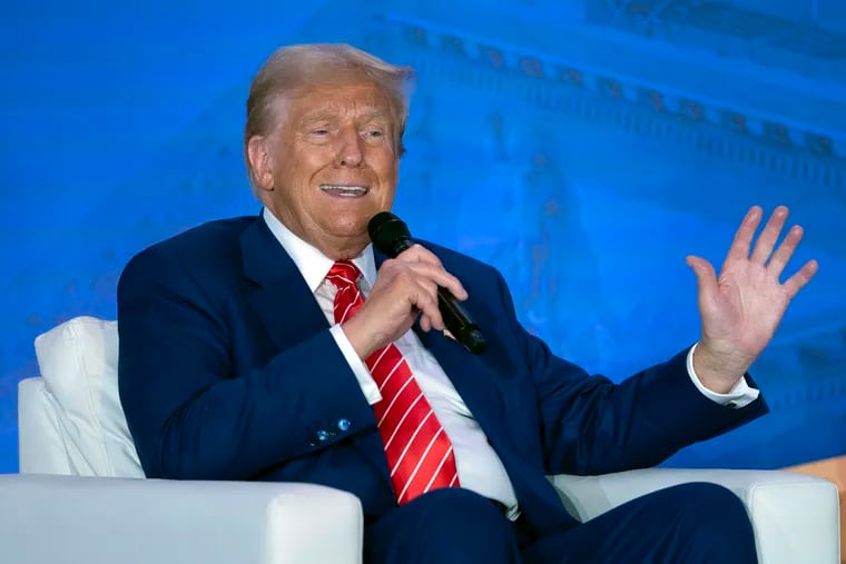 Republican presidential nominee former President Donald Trump speaks with Moms for Liberty co-founder Tiffany Justice during an event at the group's annual convention in Washington on Friday.