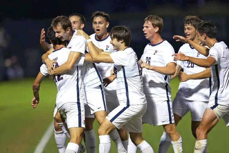 The Penn soccer team congratulates Jack Wagoner on his goal in their 1-0 upset of No. 3 Pitt on Sunday.