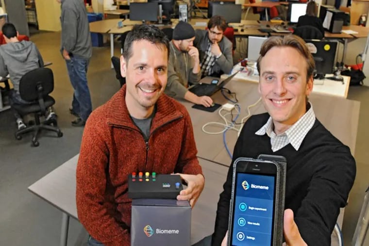 Max Perelman (front left), 37, and Jesse vanWestrienen (30, cq) two of the three founders of Biomeme, a Philadelphia-based bio-tech start-up which is working on a mobile DNA device and software which will bring DNA sequencing to the masses via their iPhone of iPod.   In the background (center) is third founder Marc DeJohn (left with hat on), 44, lead engineer and Maximillian Maksutovic, 26, lead software engineer.  They are in NextFab Studio on Washington Ave.  ( CLEM MURRAY / Staff Photographer )