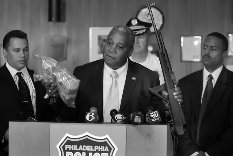 Philadelphia Police's Narcotic Strike Force with Commissioner Sylvester Johnson in 2005 showing off $ 75,000 in cash and a assult weapon.
