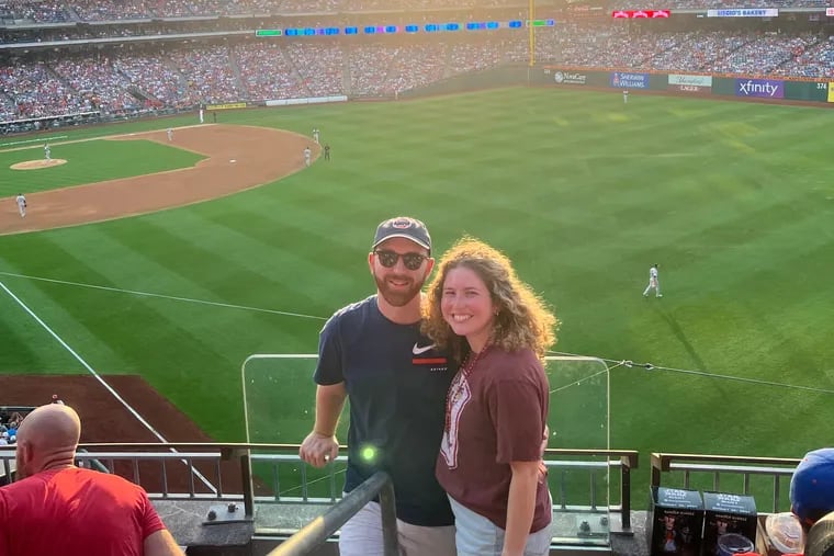 Newlyweds Beau Parker and Michele Ozer at Citizens Bank Park on Monday night. Parker is a longtime Astros fan, and Ozer is a diehard Phillies fan.