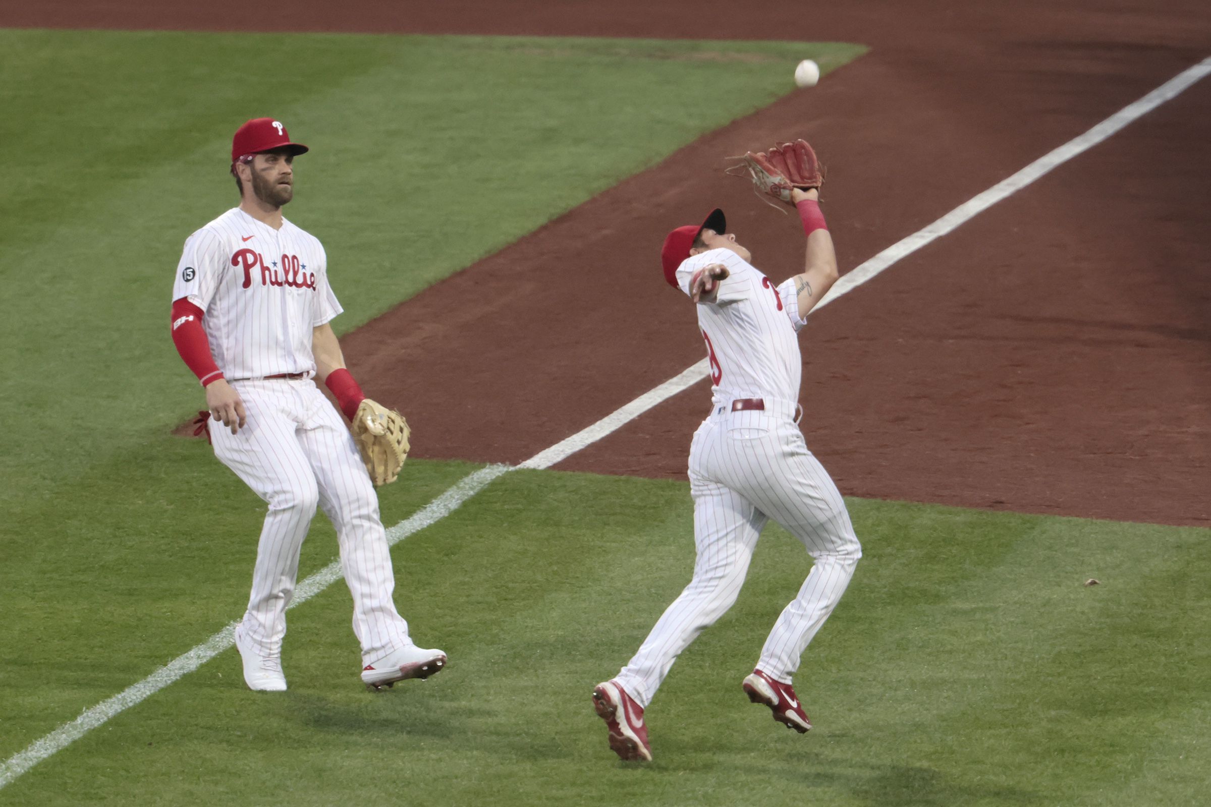 Phillies fan stretchered off after falling from railing into bullpen