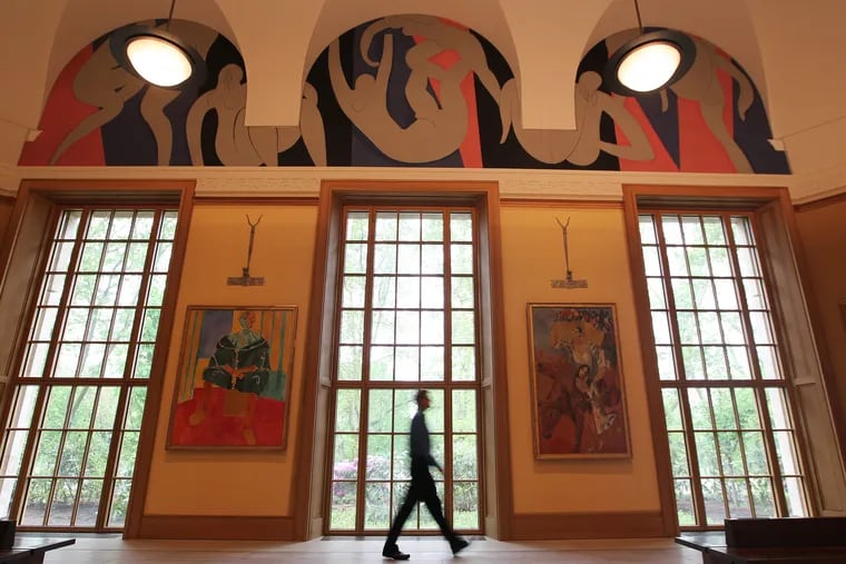 The main gallery in the Barnes has Matisse's "The Dance" above the main windows and above Picasso's "The Peasants," 1906 (right) and Henri Matisse's "Seated Riffian” (left).