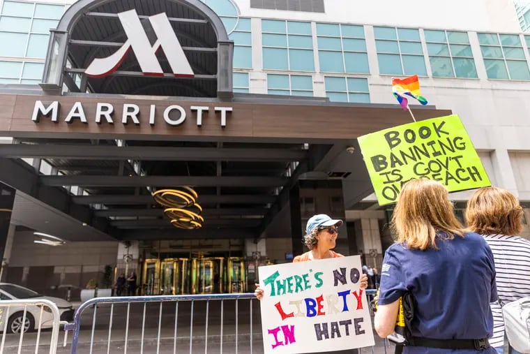 Protesters at the front of the Philadelphia Marriott Downtown hotel entrance during the visit by the group Moms for Liberty last week.