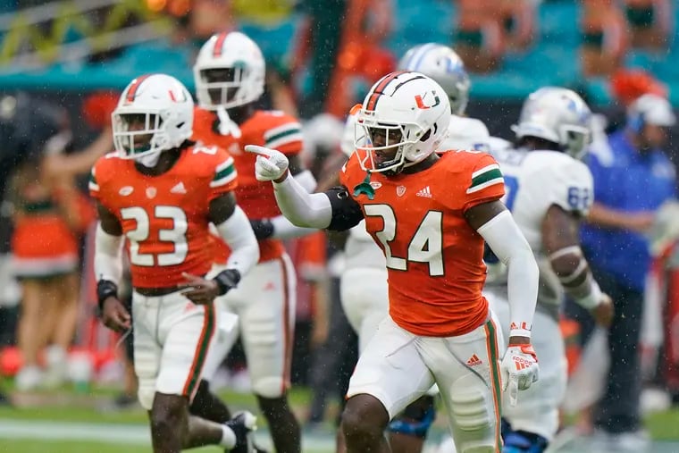 FILE - Miami safety Kamren Kinchens (24) celebrates an interception during the first half of an NCAA college football game against Middle Tennessee, Saturday, Sept. 24, 2022, in Miami Gardens, Fla. Kamren Kinchens was named to The Associated Press preseason All-America team, Monday, Aug. 21, 2023. (AP Photo/Wilfredo Lee)