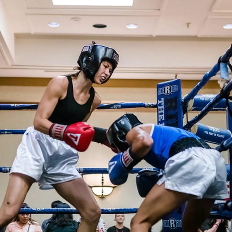 Lia Lewandowski (left) boxes Nathaly Ovando of Cedar Park, Texas, in an 110-pound bout at the Texas Women's Championship on Sept. 3, 2022.