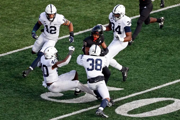 Rutgers wide receiver Bo Melton is tackled by Penn State safety Lamont Wade (38) on Saturday.