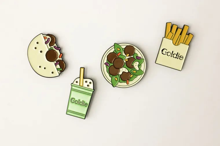 Local illustrator Lauren Cat West on a series of pins showcasing favorites from Goldie, Michael Solomonov’s fast-casual falafel restaurant.