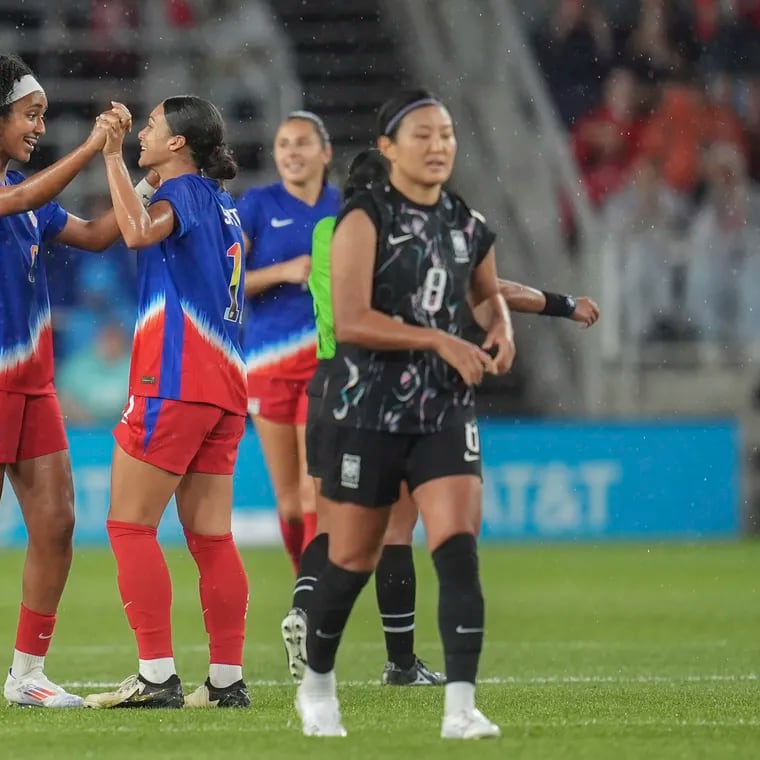 Lily Yohannes (left) celebrates with Sophia Smith (center) after scoring a goal in her U.S. women's soccer team debut.