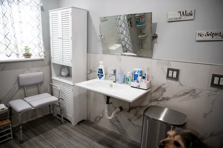 A wheelchair-accessible bathroom is just one of the modifications that Stephanie Andrilla made to her South Philly home after her daughter, Mia, was paralyzed.