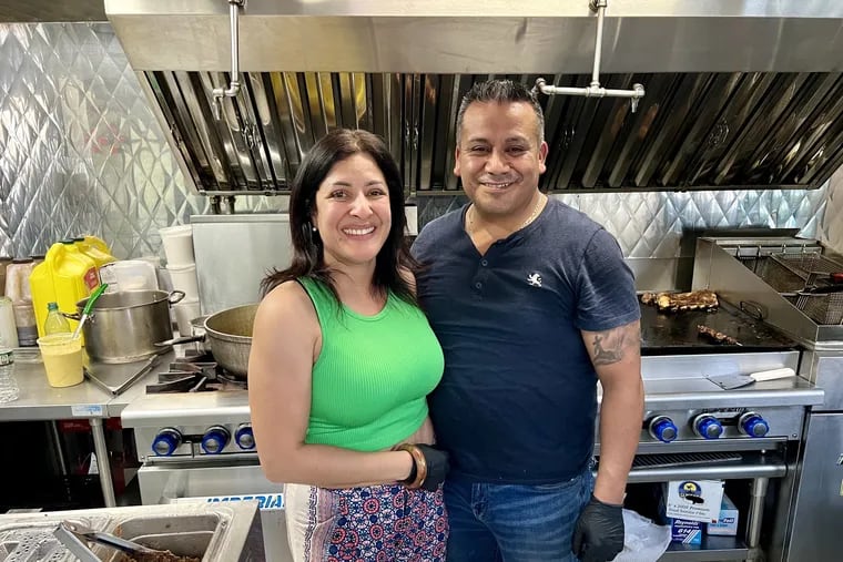 Mariangeli Alicea Saez and Dionicio Jiménez at their pop-up restaurant on Cherry Street Pier on June 14, 2024.