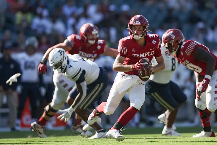 Temple quarterback E.J. Warner completed 28 of 49 passes for 292 yards and two touchdowns against Akron on Saturday.