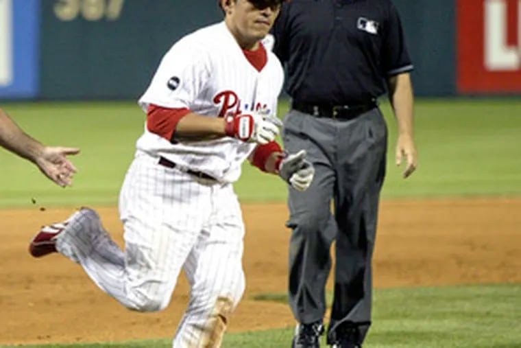 Carlos Ruiz rounds third base after hitting walkoff home run against Brewers.