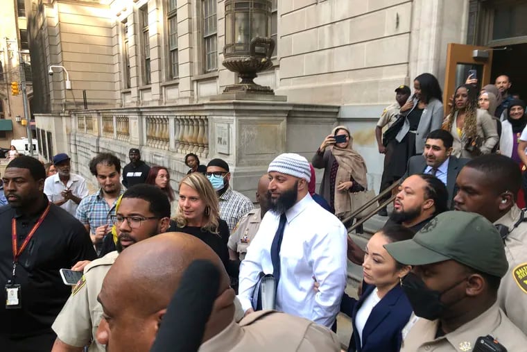 Adnan Syed, center, leaves the Elijah E. Cummings Courthouse in Baltimore. A judge has ordered the release of Syed after overturning his conviction for a 1999 murder that was chronicled in the hit podcast “Serial.”