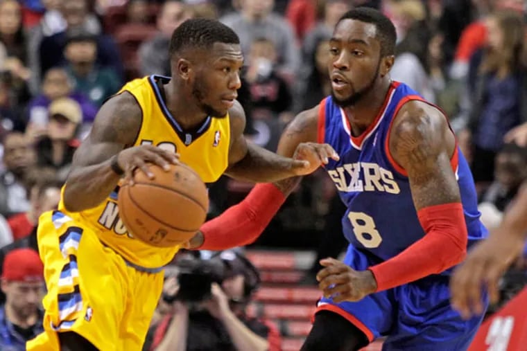 The Golden State Warriors' Nate Robinson (2), right, blocks a shot