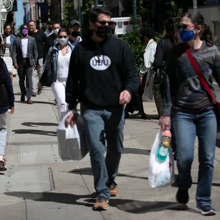 People shop along Walnut Street in Center City in 2021. The foot traffic has changed since the pandemic ended.