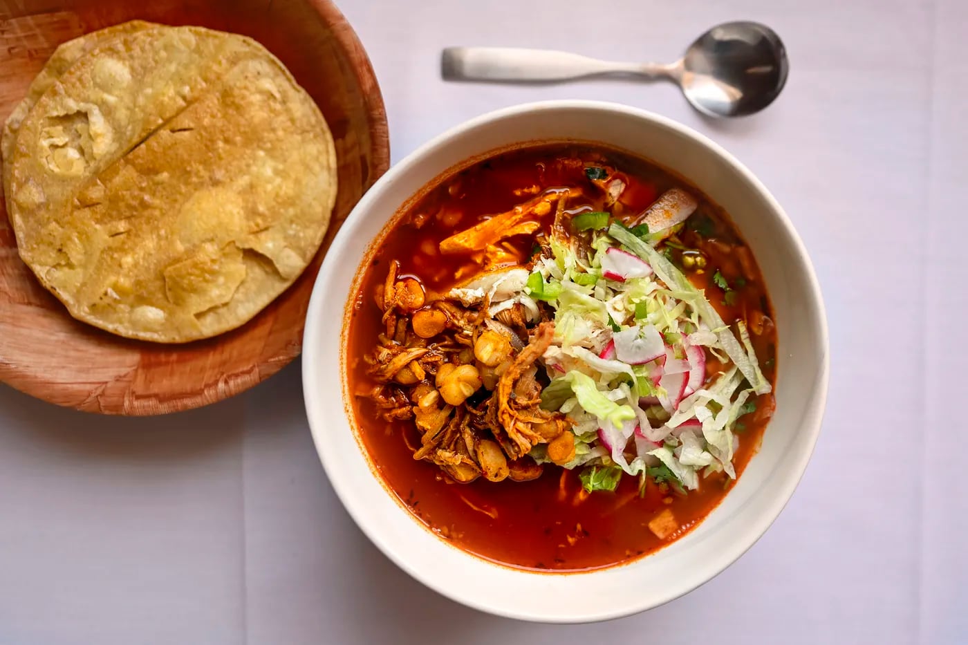The pozole rojo is a soulful bowl of hominy stew with chicken at Los Machetes.